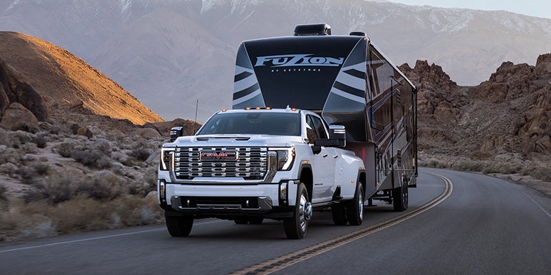 A new 2025 GMC Sierra-HD Truck sits parked by water in bay Springs, MS